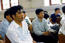 image: workers at meeting