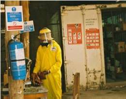 Grpahic: pesticide worker in protective clothing
